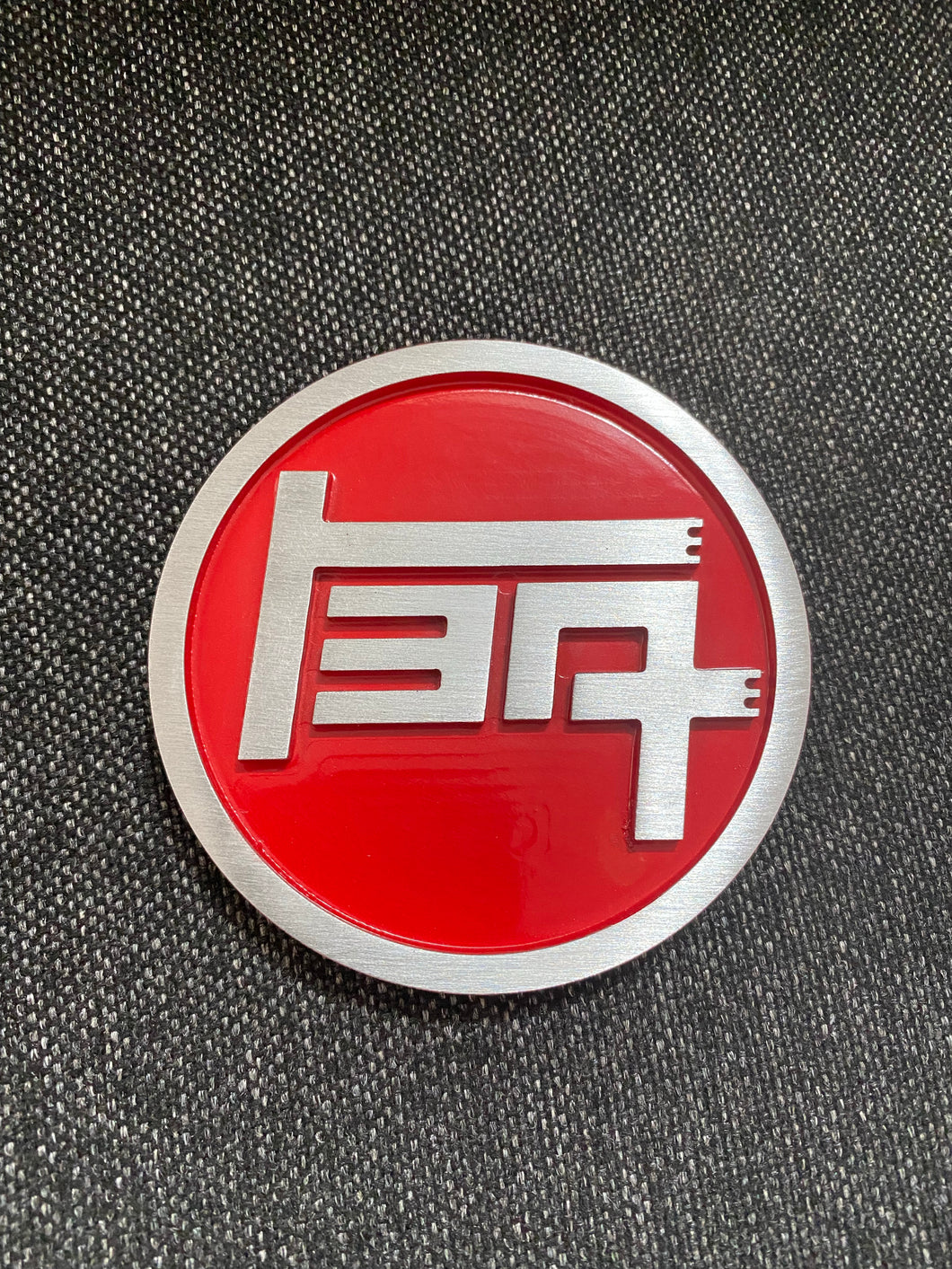 TEQ badge CNC machined